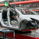 A Tesla Model Y rolls through an assembly line in Austin, Texas, but the EV still relies on foreign battery components.